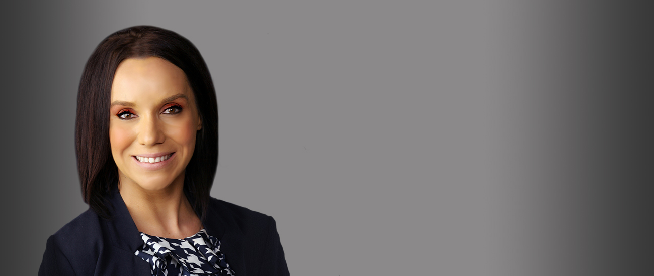 Genine Ann Mejia with a gray background