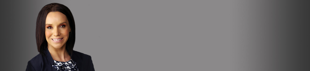 Genine Ann Mejia with a gray background